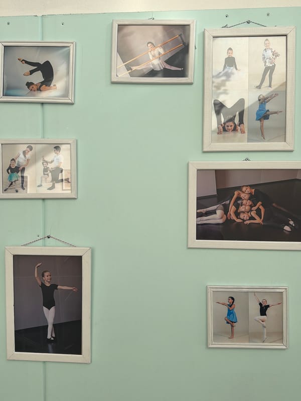 Ballet photo collection displayed on wall in Saint Petersburg