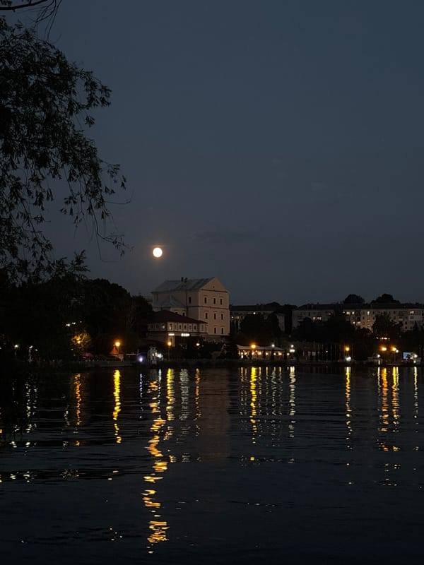 Summer evening along Ternopil Lake's busy waterfront promenade