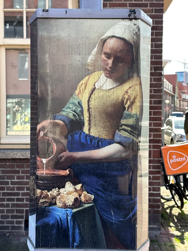 Amsterdam street scenes captured: Vermeer art, contrails, urban details