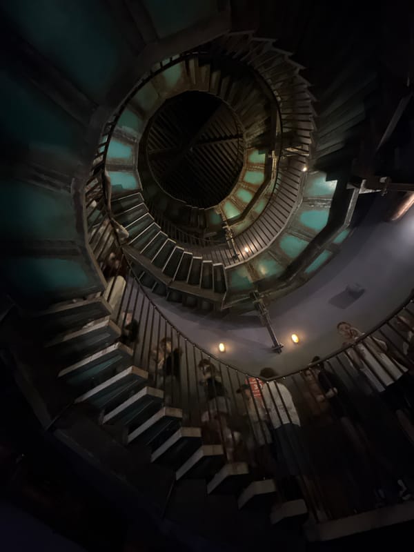 People climb spiral staircase in Moscow building