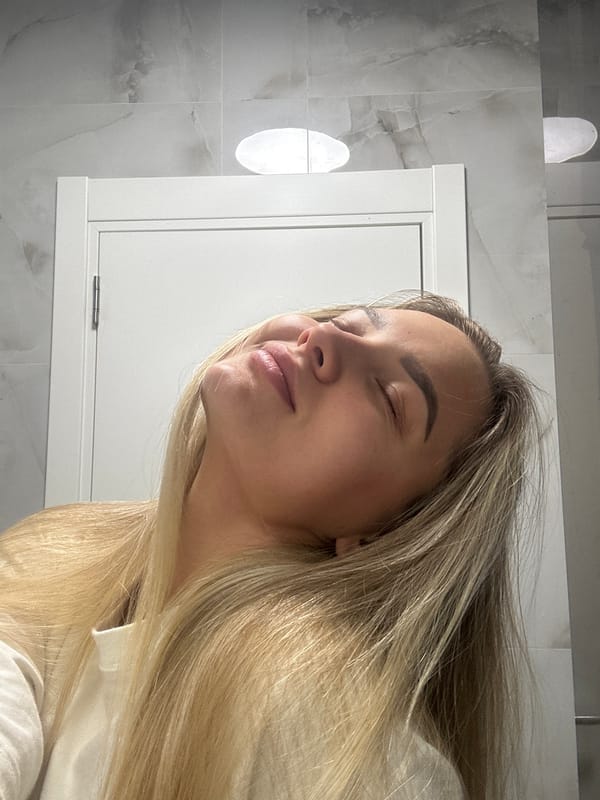 Woman takes morning selfies while getting ready in Budva