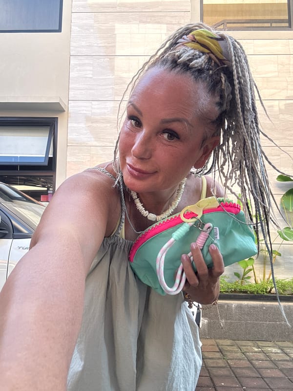 Woman takes selfie with colorful accessories in Kuta