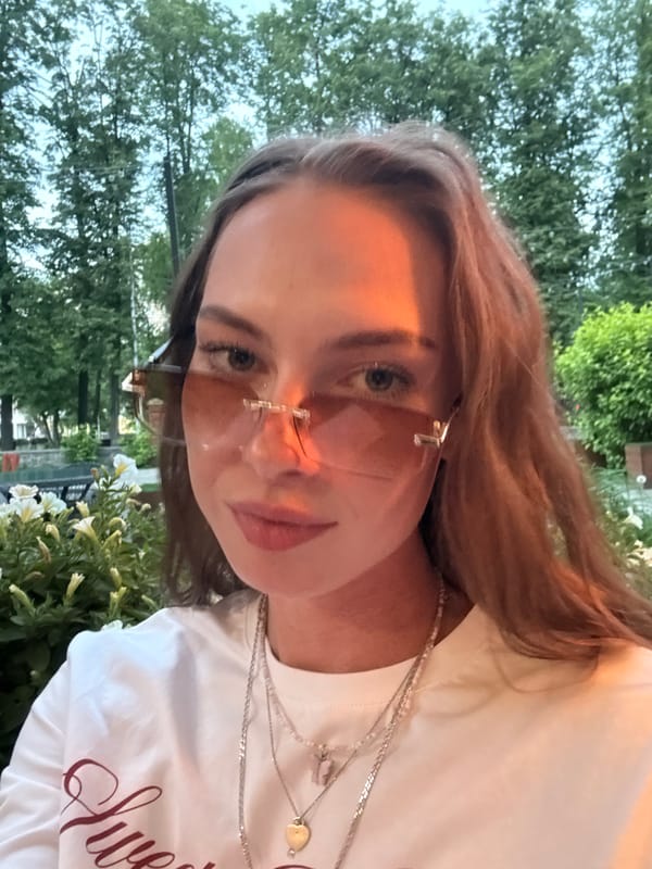 Woman takes multiple selfies outdoors in Perm, Russia