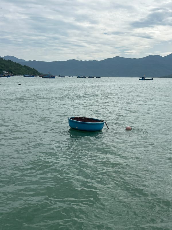 Fishing boats, speedboat, and ferry off the Vietnam coast