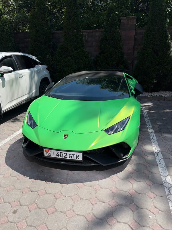 Green Lamborghini spotted parked in Almaty cobblestone lot