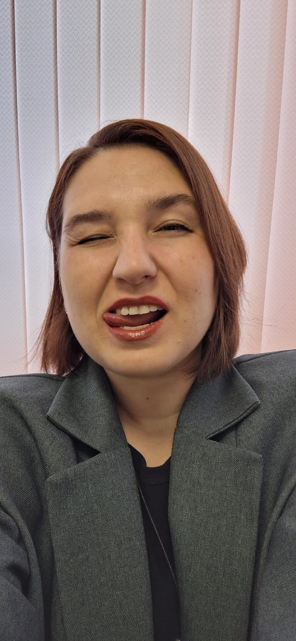 Woman in gray blazer photographed in contemplative poses, Chernushka