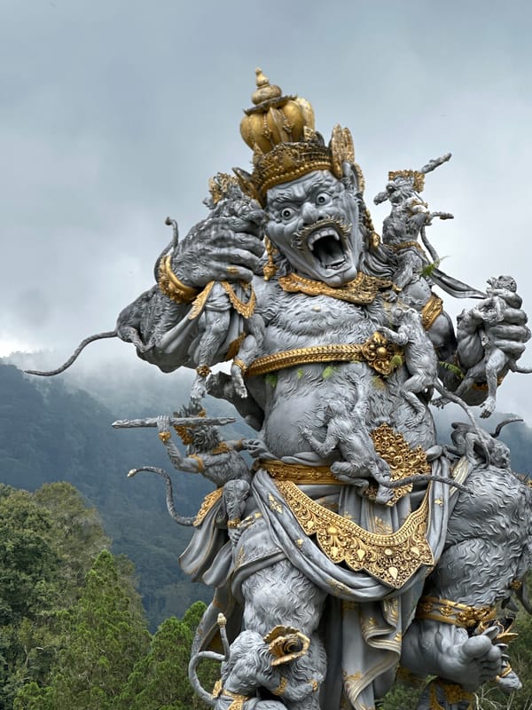 Ornate deity statue with golden accents documented in Baturiti