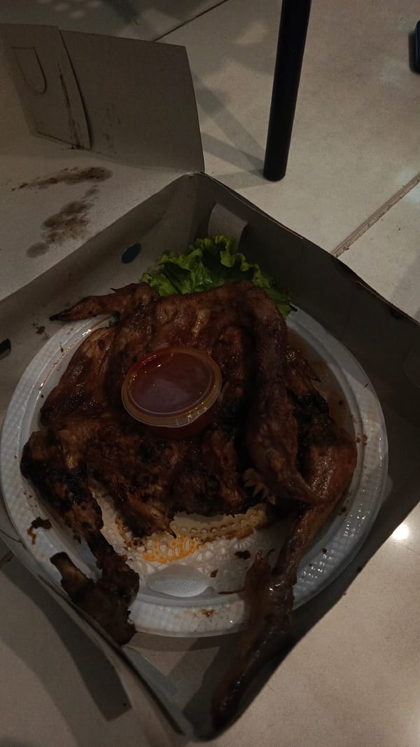 Roasted chicken takeout documented in Surabaya, Indonesia