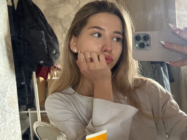 Woman takes multiple selfies in Noviy, Russia