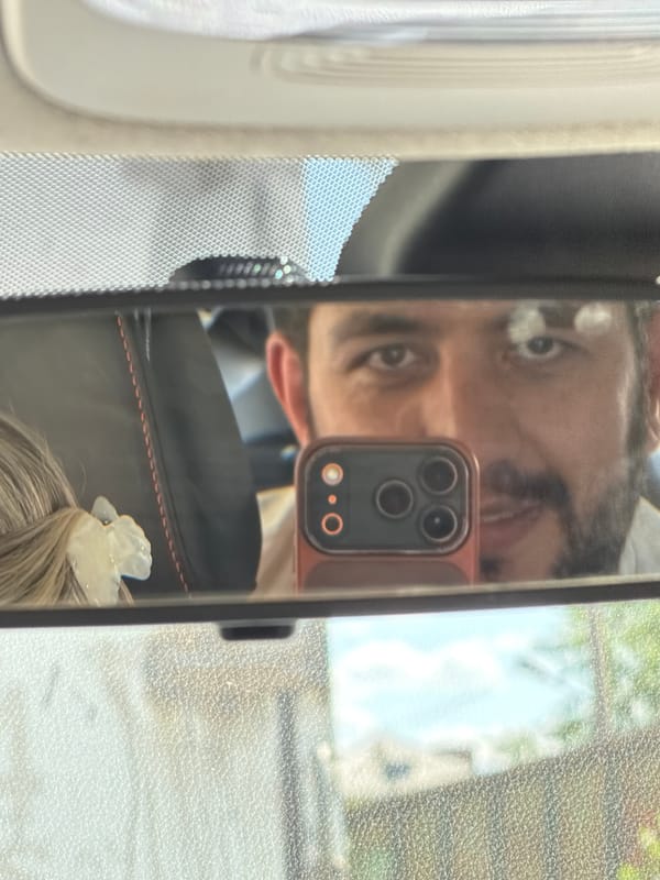 Woman driving photographed via rearview mirror in Krasnoyarsk