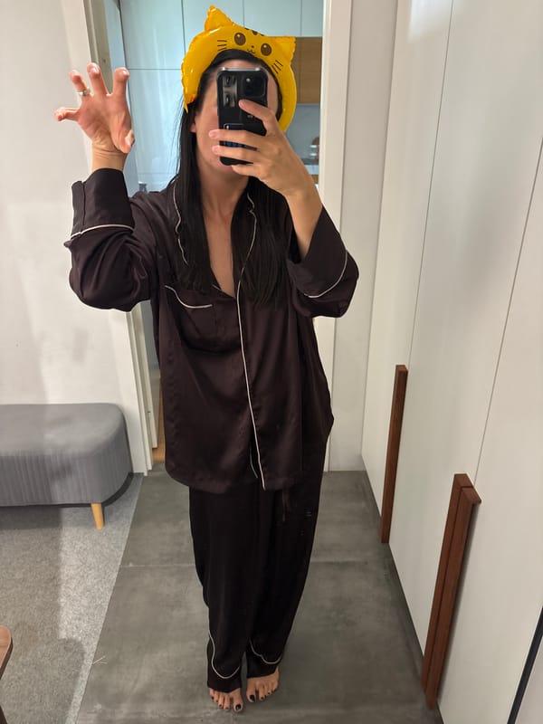 Person takes mirror selfie in cat-ear headband in Russia