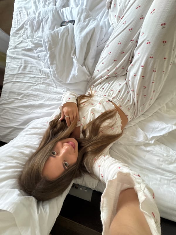 Woman photographed in cherry-patterned outfit at Sosnovy residence