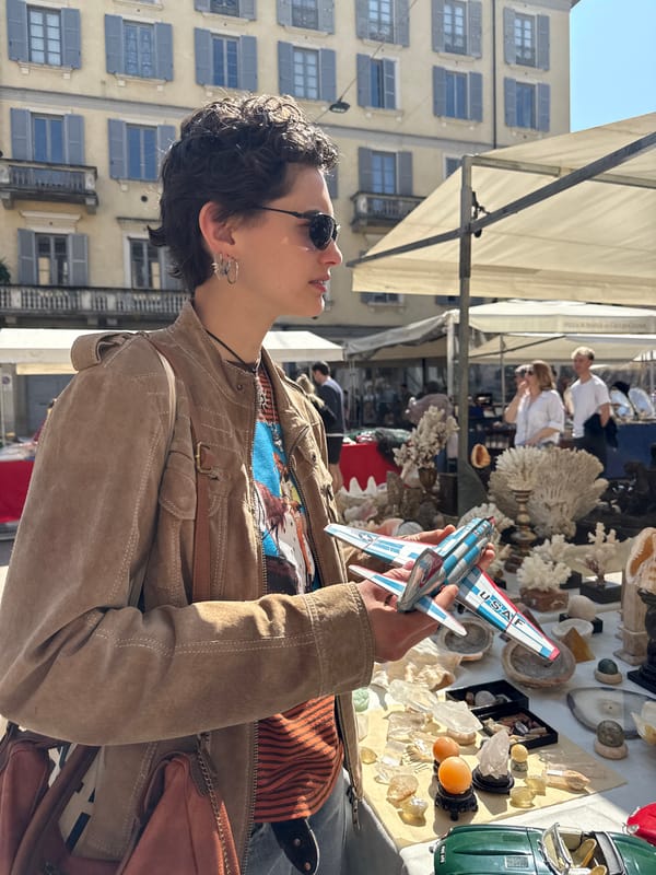 Outdoor market vendors sell toys, games, glassware in Milan