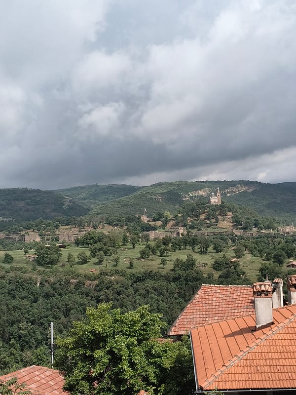 Historic Veliko Tarnovo landscape documented under cloudy Bulgarian skies