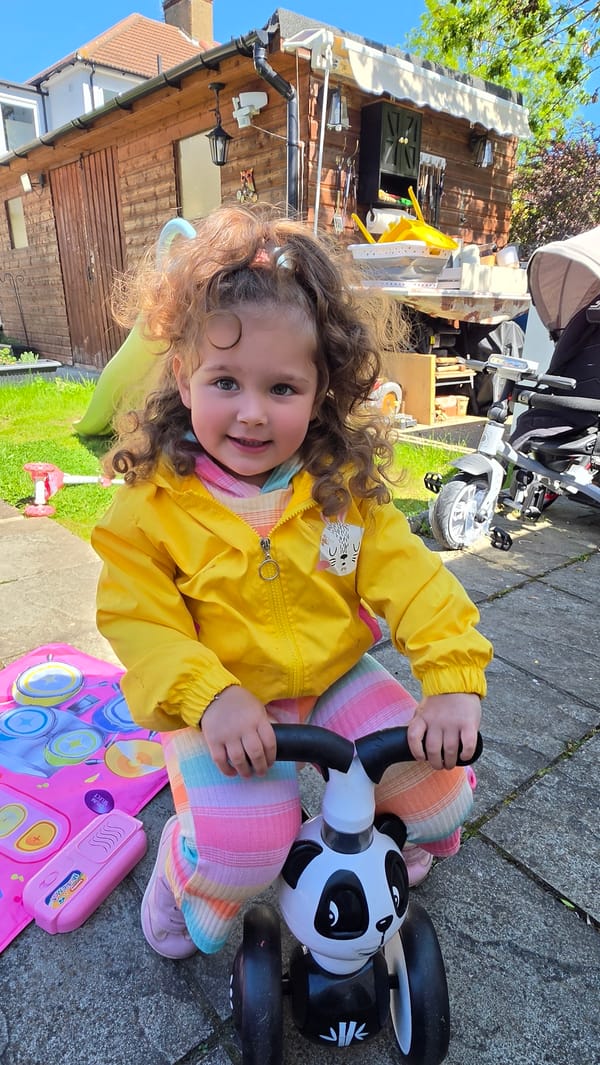Child on panda tricycle, tabby cat spotted in London