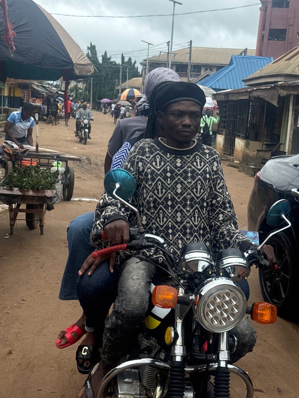 Morning market hustle on a dirt road in Ihiagwa, Nigeria