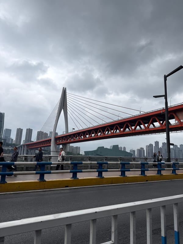 Pedestrian captures red bridge view in Yuzhong District