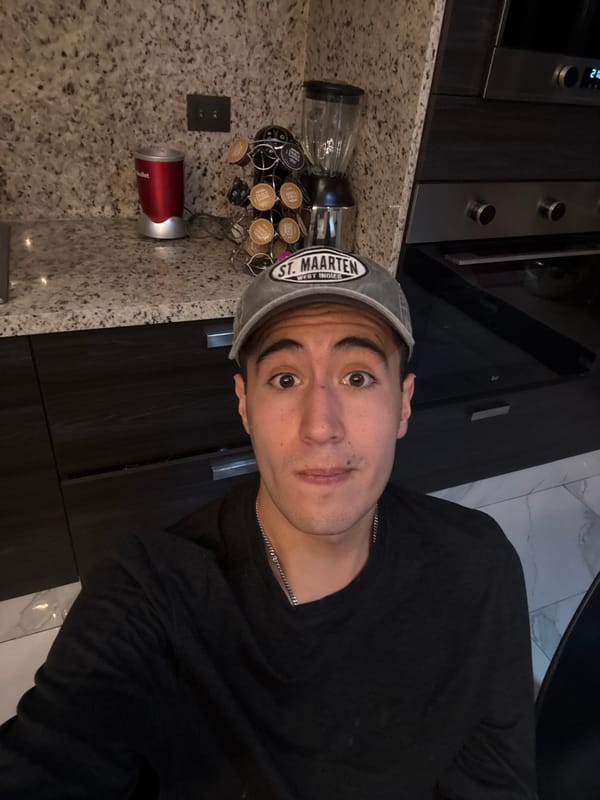 Person makes smoothie, plays with dog in Mexican kitchen