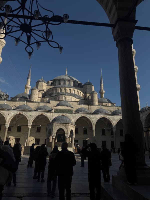 Couple photographs tourist visit at Istanbul's Blue Mosque