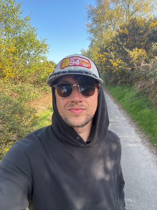 Man takes selfie on flower-lined path in East Suffolk
