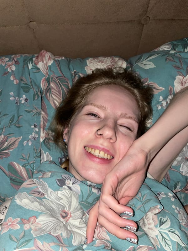 Person captured smiling in bed in Izhevsk, Russia