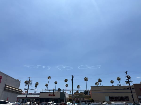 LA street market buzzes under heart-shaped contrails