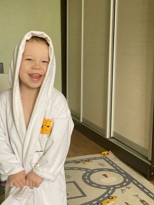 Child's bath time and play documented in Sochi home