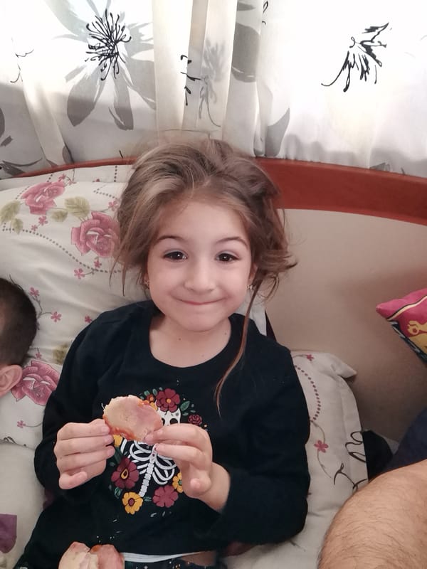 Children eat pizza, play superheroes in Bulgarian home