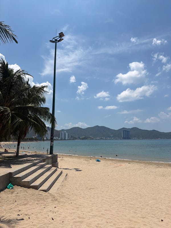 Morning beach life and coastal traffic in Nha Trang