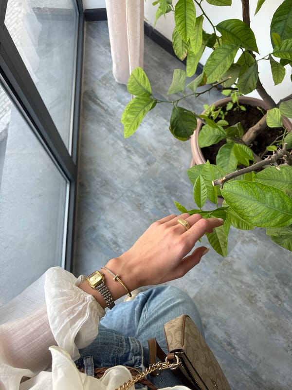 Woman tends indoor lemon tree in Armenian village