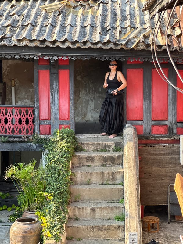 Traditional Thai building with ornate roofing documented in Bangkok