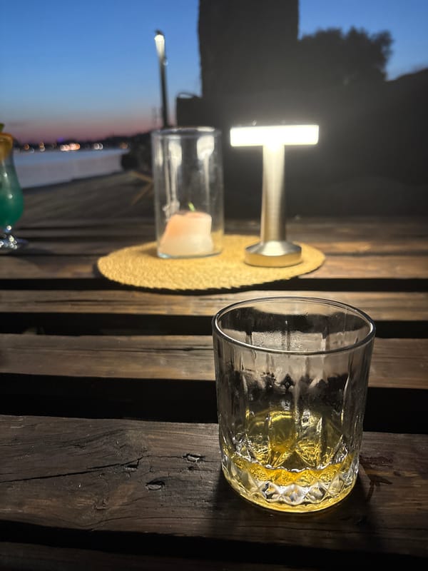 Lakeside drinks and a toast at dusk in Mikołajki