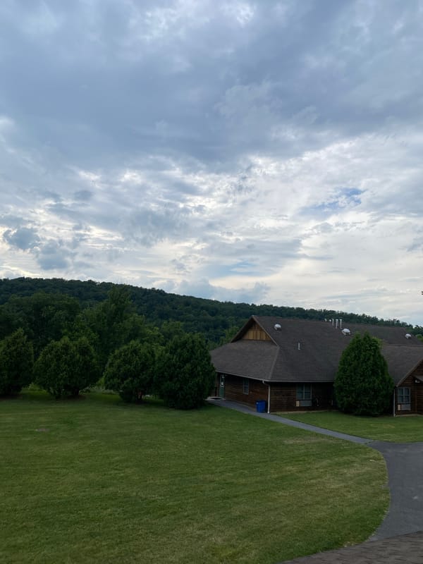 Outdoor amphitheater stage in wooded Washington Township setting