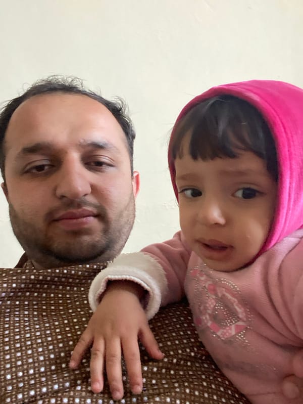 Father and child photographed in Kandahar home
