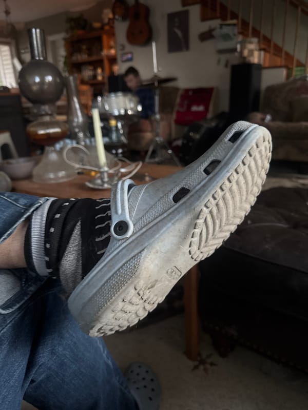 Person spotted wearing blue Crocs and striped socks in Boulder