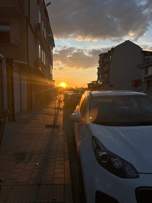 Golden sunset illuminates street scene in Pomorie, Bulgaria