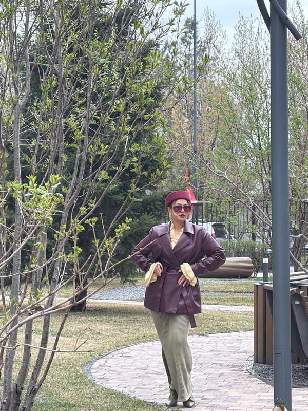Woman in burgundy outfit photographed in Krasnoyarsk park