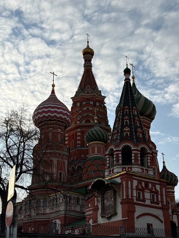 Tourists document Moscow landmarks at Red Square and Bolshoi Theatre
