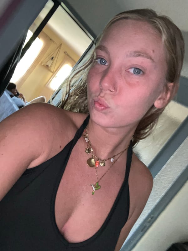 Woman takes selfies in personal room in Lannoy