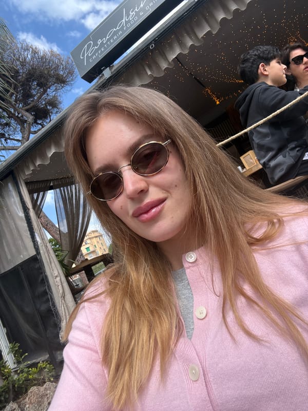 Tourist takes selfie near historic domed building in Anzio