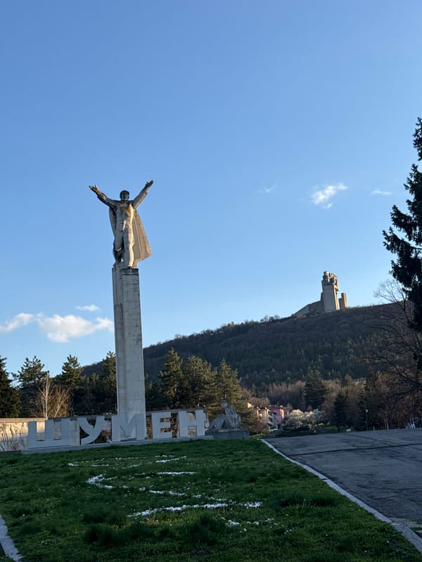 Tourist photographs historic Bulgarian monument in Shumen