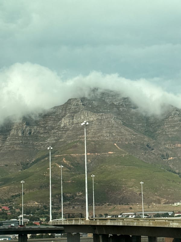 Clouds partially obscure Table Mountain peak in Cape Town