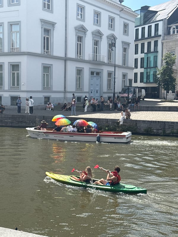 Sunny afternoon on Ghent's canals and cathedral streets