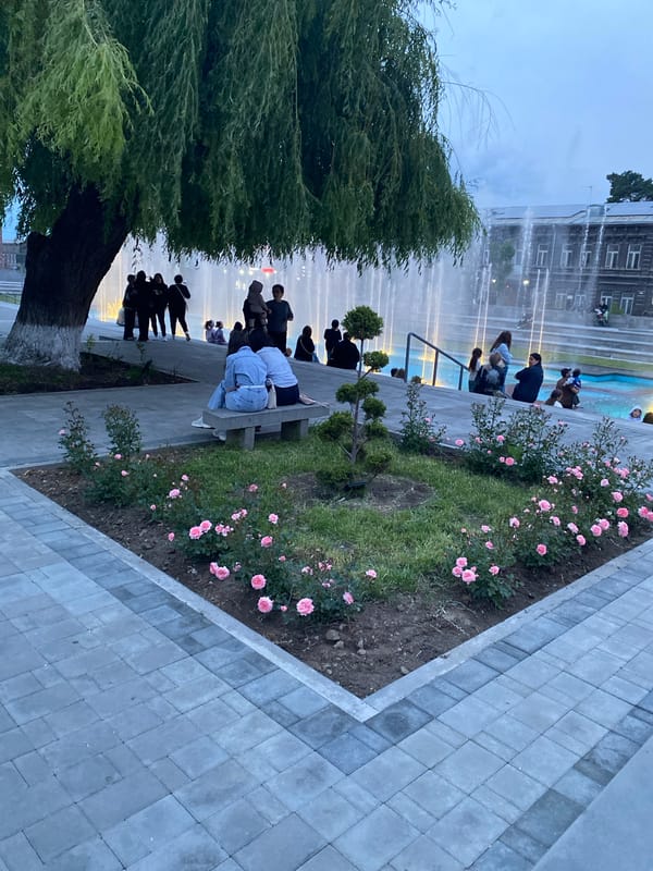 Gyumri's lit fountain square at dusk, June 2026
