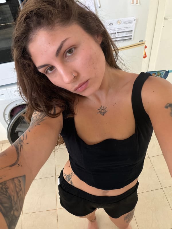Woman takes selfies in Kiryat Bialik home