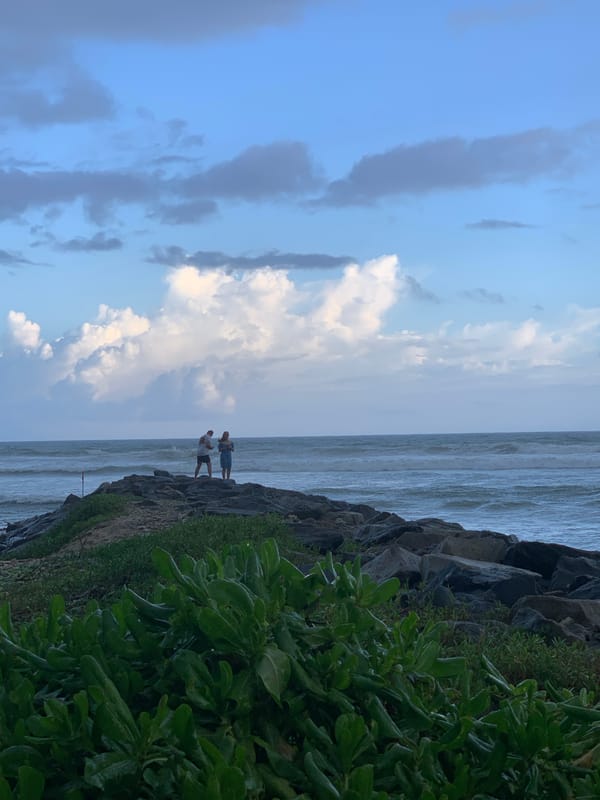 Couple spotted on rocky breakwater in Ahangama, Sri Lanka