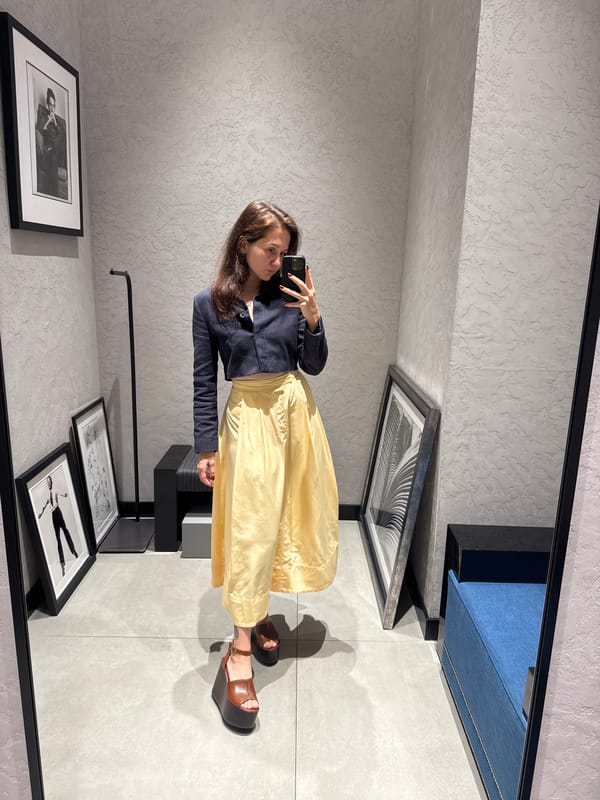 Woman photographs herself in Dubai clothing store early morning