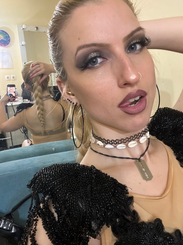 Mirror selfie captured in Plovdiv featuring glittered makeup, jewelry
