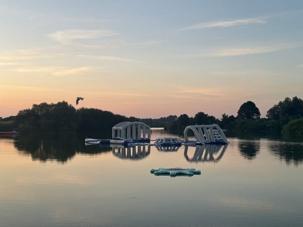 Inflatable water park on a Craigavon lake at twilight