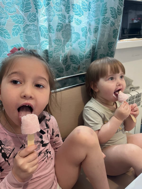 Children enjoy ice cream popsicles in Samara, Russia